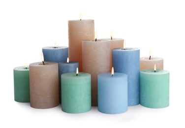 Photo of Set of different color candles on white background