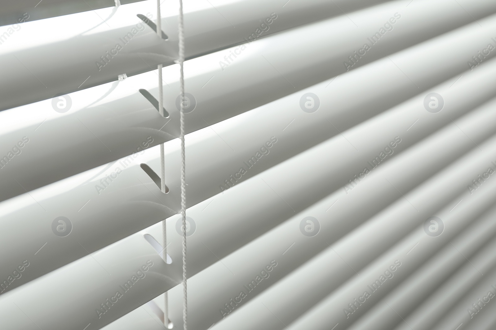 Photo of Closeup view of window with horizontal blinds