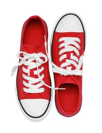 Pair of red classic old school sneakers isolated on white, top view