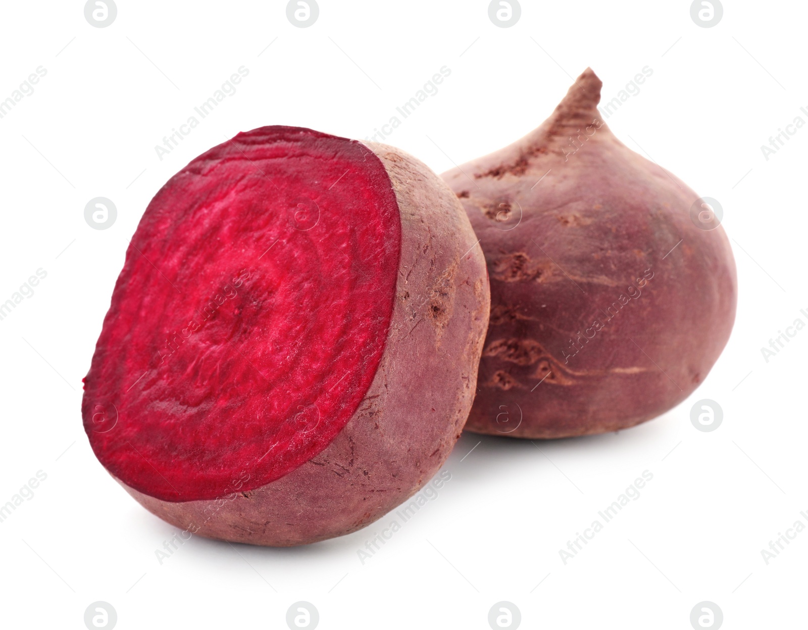 Photo of Cut and whole beets on white background. Taproot vegetable