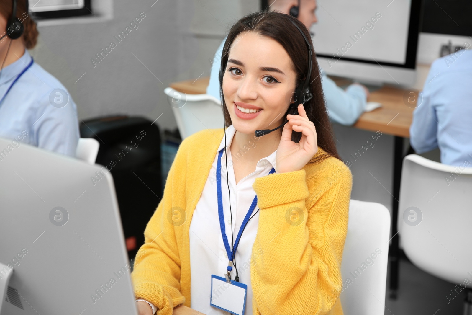 Photo of Technical support operator working with colleagues in office