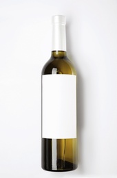 Photo of Bottle of delicious wine with blank label on white background