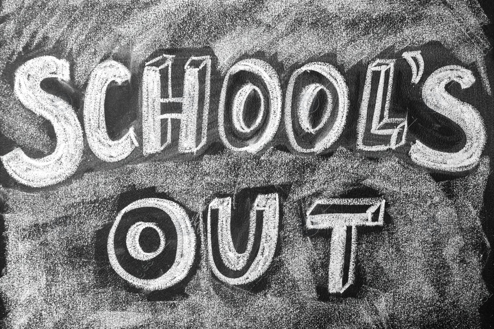 Photo of Text School's Out written on black chalkboard. Summer holidays