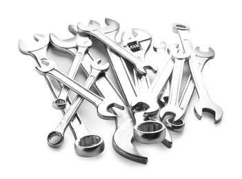Photo of Set of different wrenches on white background. Plumbing tools