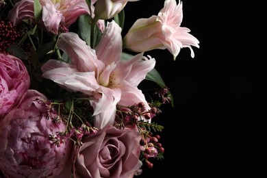 Photo of Beautiful bouquet of different flowers on dark background, closeup