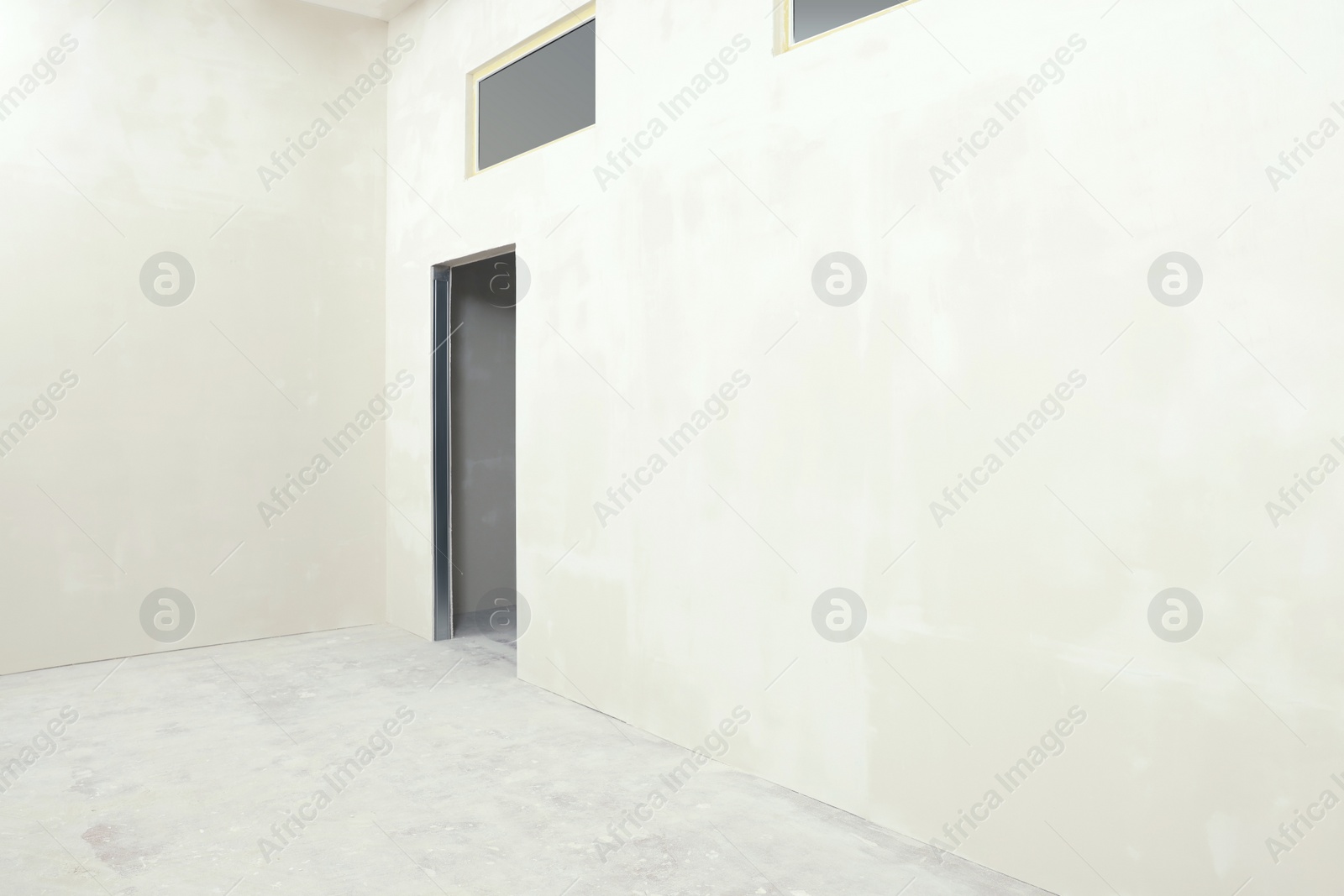 Photo of Empty room with white walls and windows