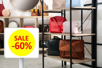 Image of Sign with text SALE and 60 percent discount in stylish bag store. Special promotion