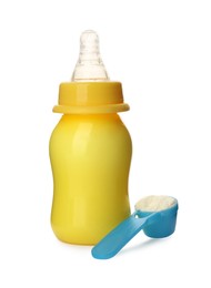 Photo of Feeding bottle with infant formula and scoop of powder on white background. Baby milk