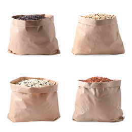 Image of Set with different types of rice in paper bags on white background