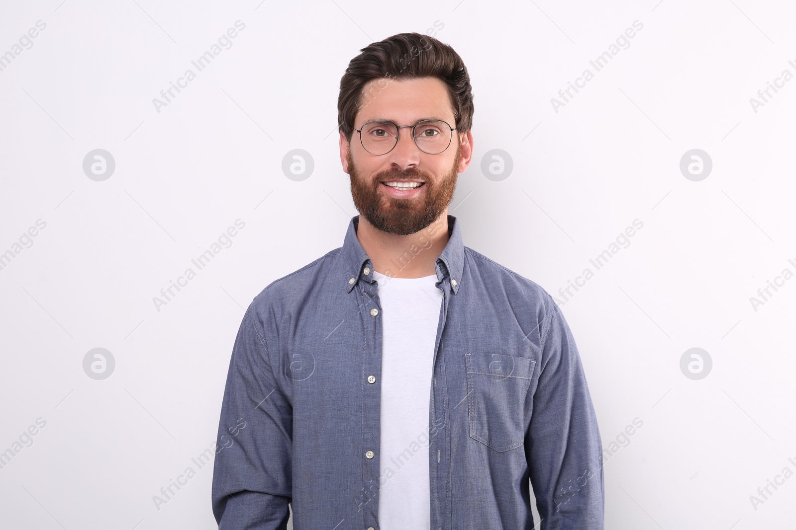 Photo of Portrait of handsome man in glasses on white background