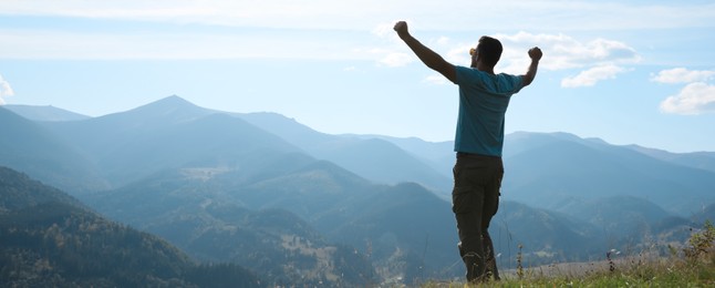 Image of Tourist in mountains on sunny day, banner design