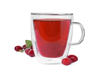 Photo of Glass cup of fresh dogwood tea and berries on white background