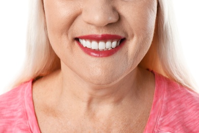 Smiling woman with perfect teeth on white background, closeup