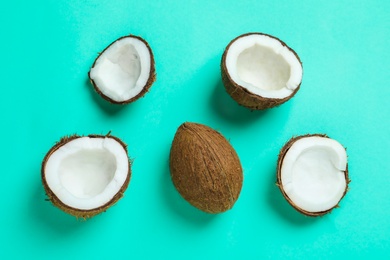 Photo of Ripe coconuts on color background