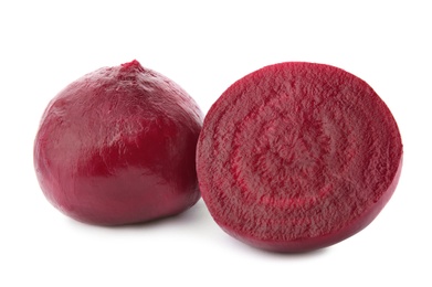 Photo of Whole and cut boiled red beets on white background