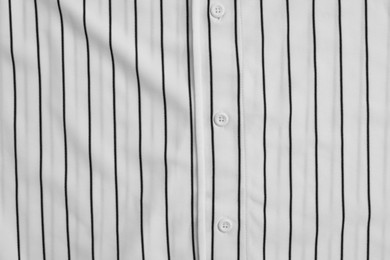 Photo of Striped baseball uniform as background, top view