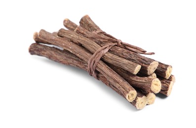 Dried sticks of liquorice root on white background