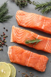 Photo of Fresh salmon and ingredients for marinade on grey table, flat lay