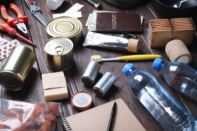 Disaster supply kit for earthquake on wooden table
