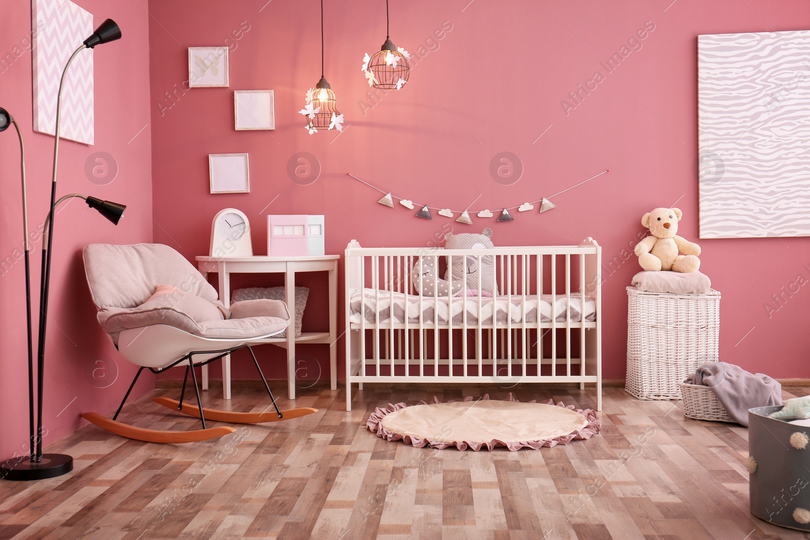 Photo of Modern baby room interior with crib and rocking chair