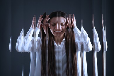 Image of Woman suffering from paranoia on dark background, glitch effect
