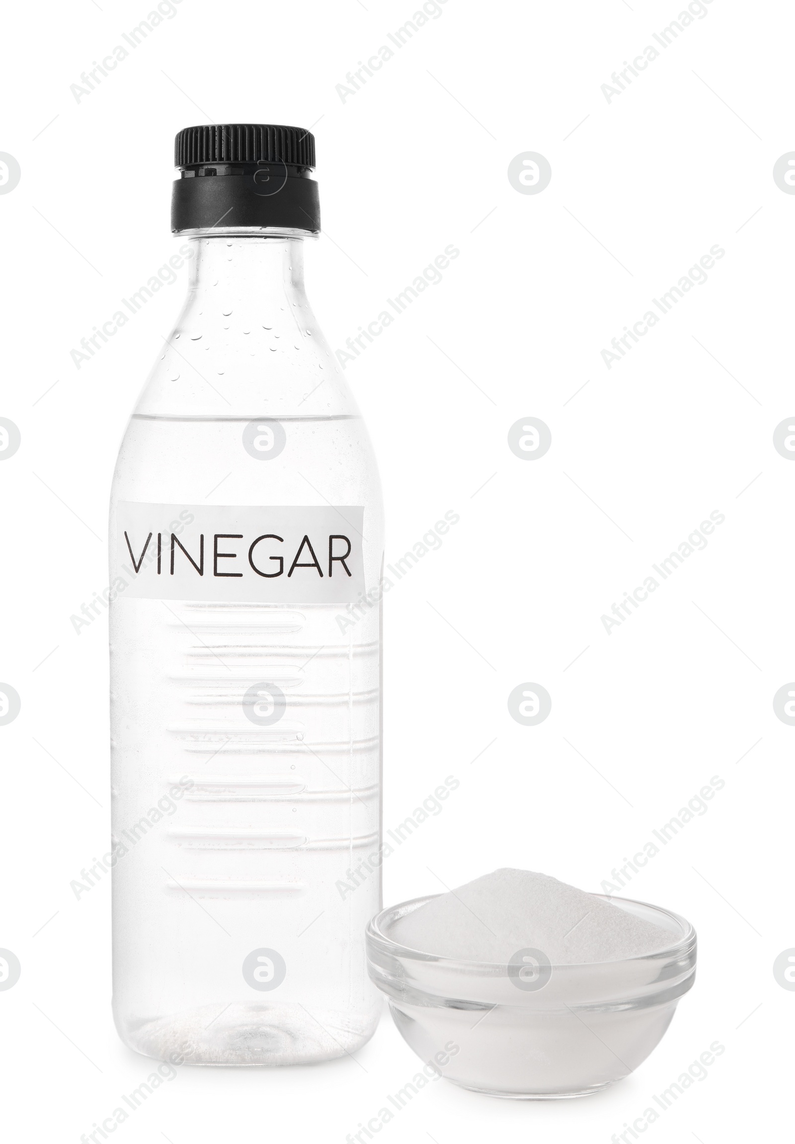 Photo of Eco friendly natural cleaners. Vinegar in bottle and bowl of soda isolated on white