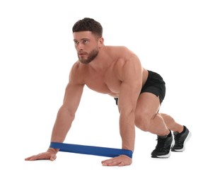 Young man exercising with elastic resistance band on white background