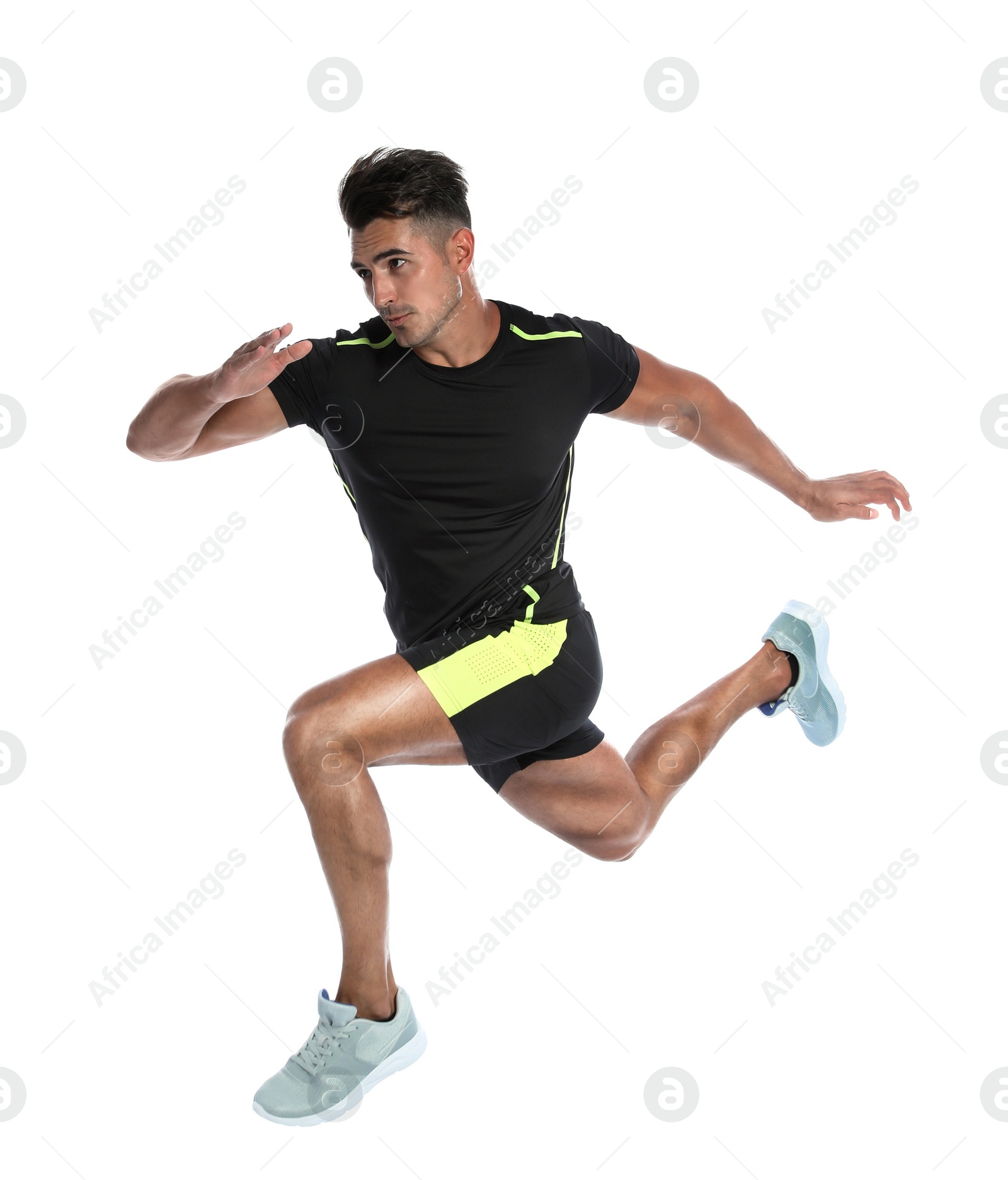 Photo of Sporty young man running on white background