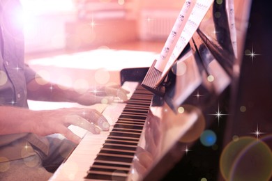 Man playing piano indoors, closeup. Christmas music