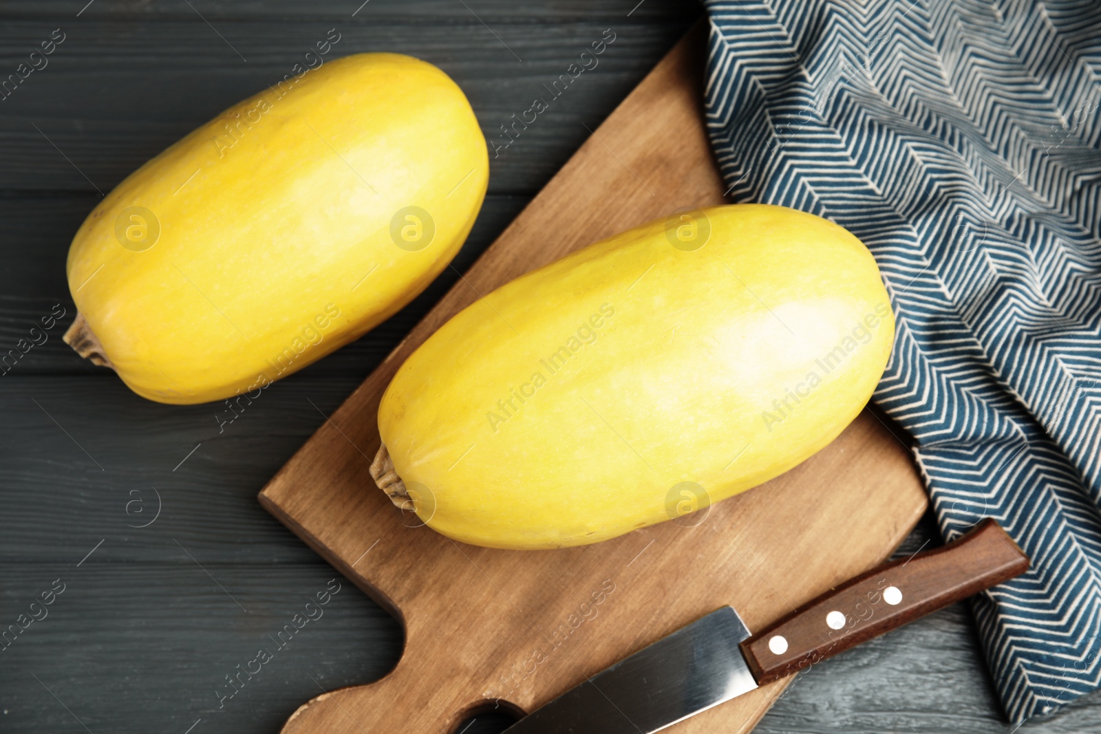 Photo of Whole ripe spaghetti squashes on wooden background