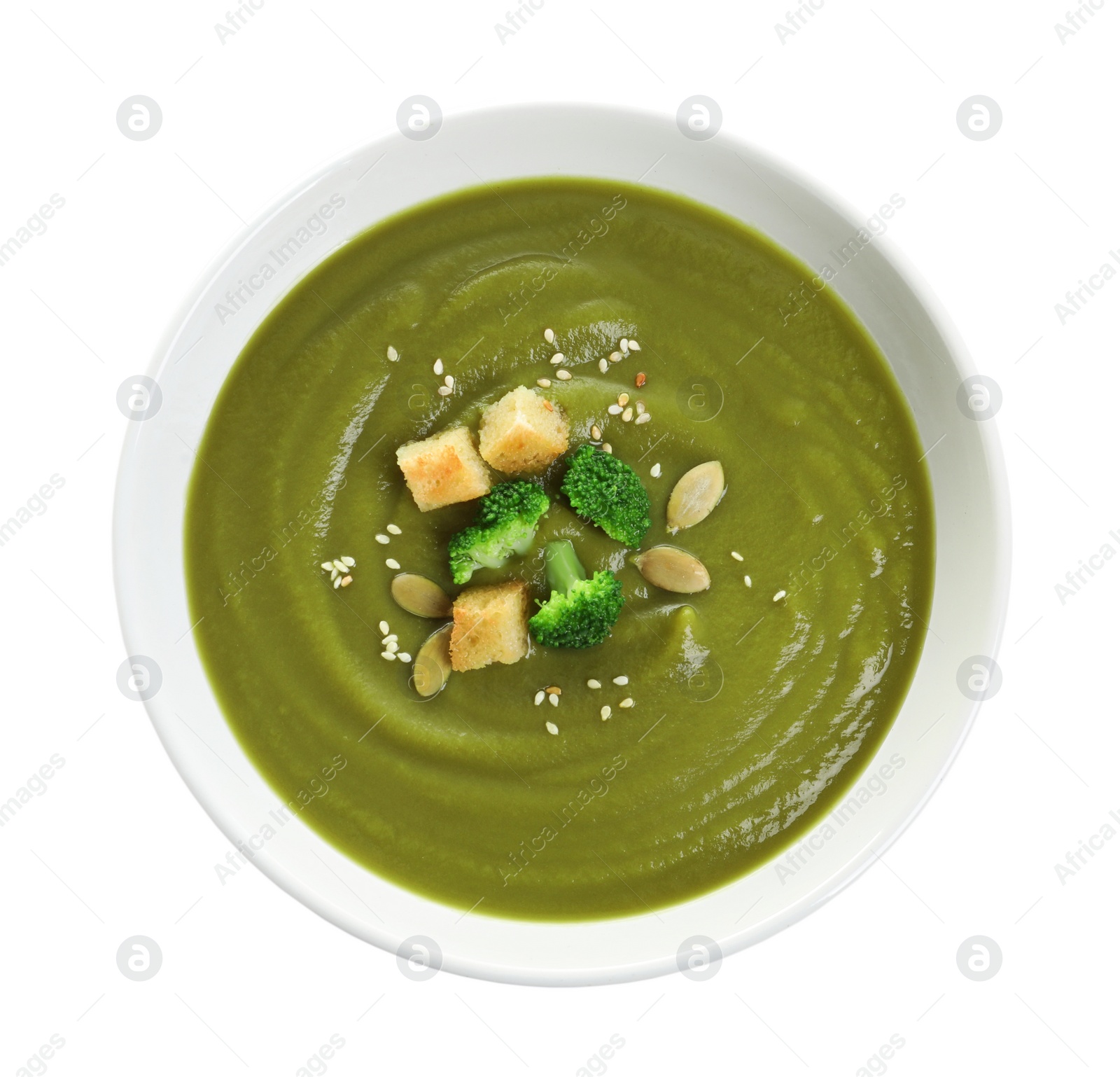 Photo of Dish with broccoli cream soup on white background, top view. Healthy food