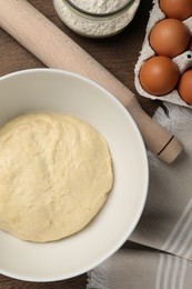 Photo of Cooking scones with soda water. Dough and ingredients on wooden table, flat lay