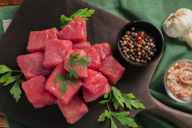 Raw beef meat and different ingredients for cooking delicious goulash on table, flat lay