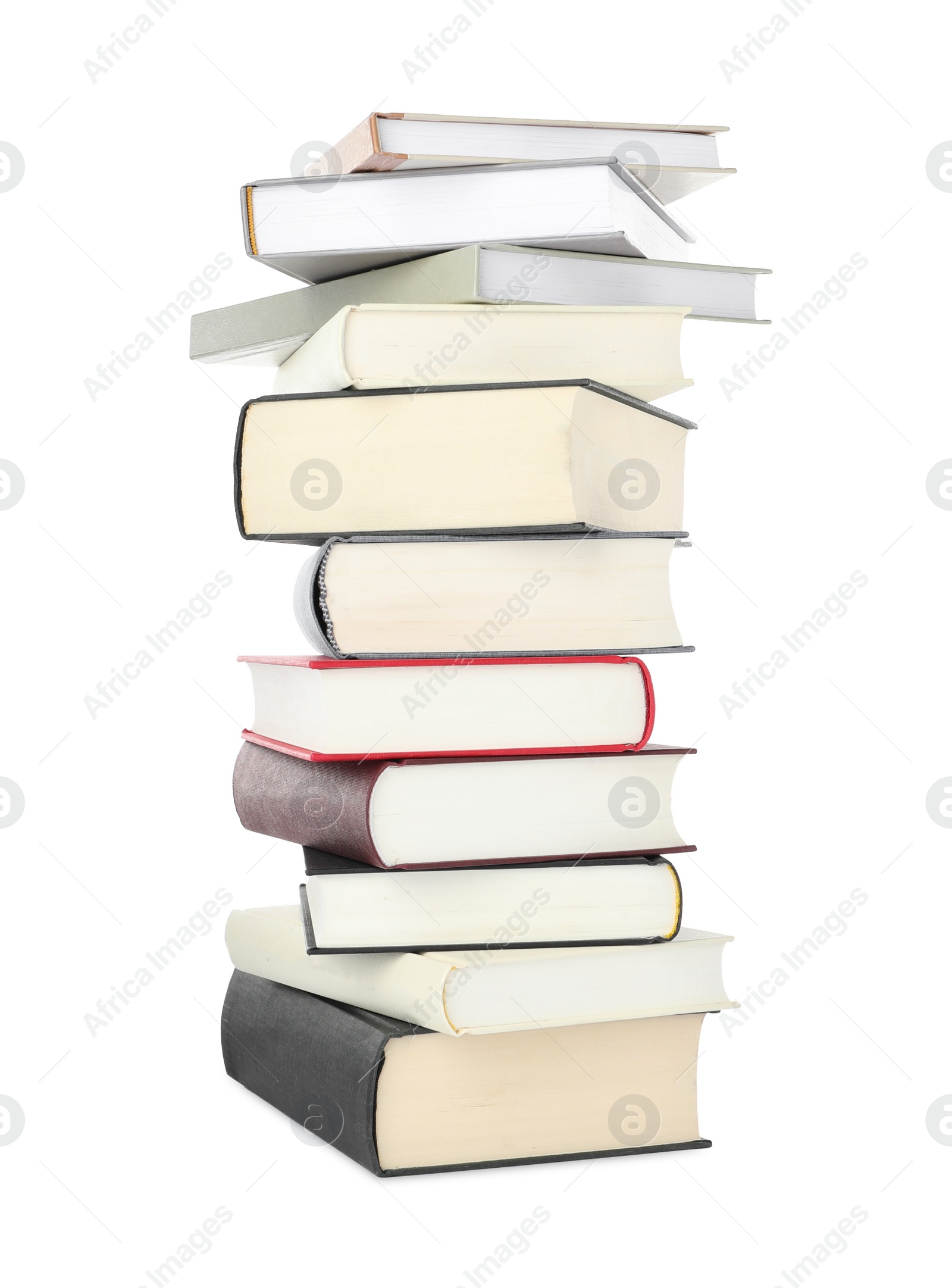 Photo of Many different books stacked on white background