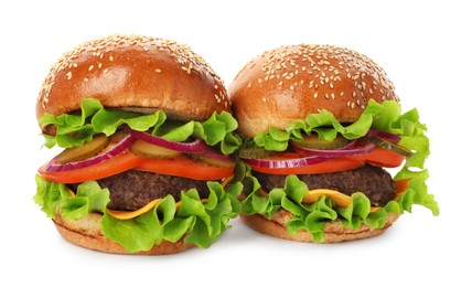 Photo of Yummy burgers with patties, cheese, fresh vegetables on white background. Fast food