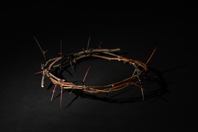 Photo of Crown of thorns on dark background. Easter attribute
