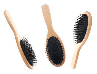 Image of Set with wooden hair brushes on white background