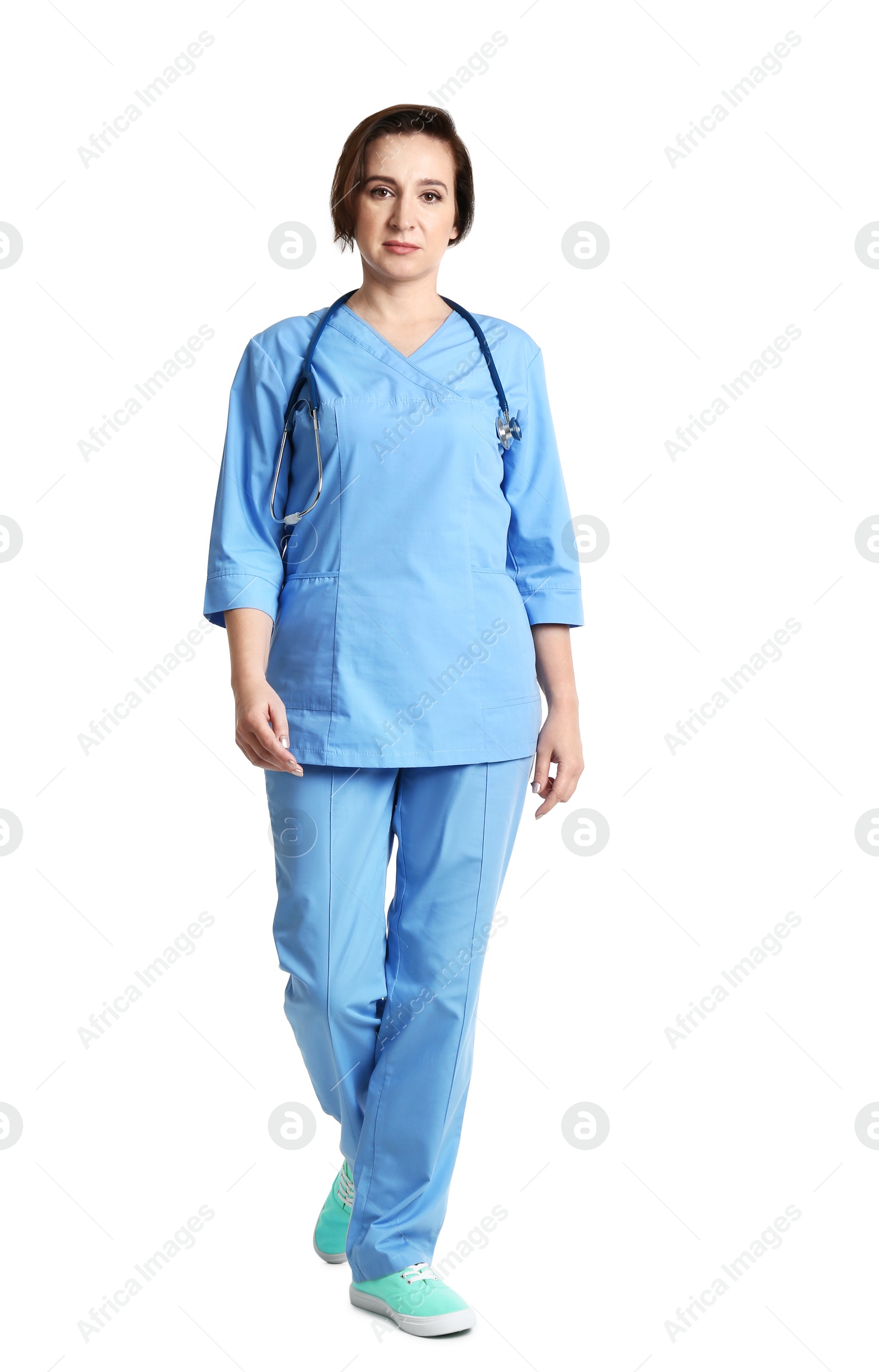 Photo of Full length portrait of experienced doctor in uniform on white background. Medical service