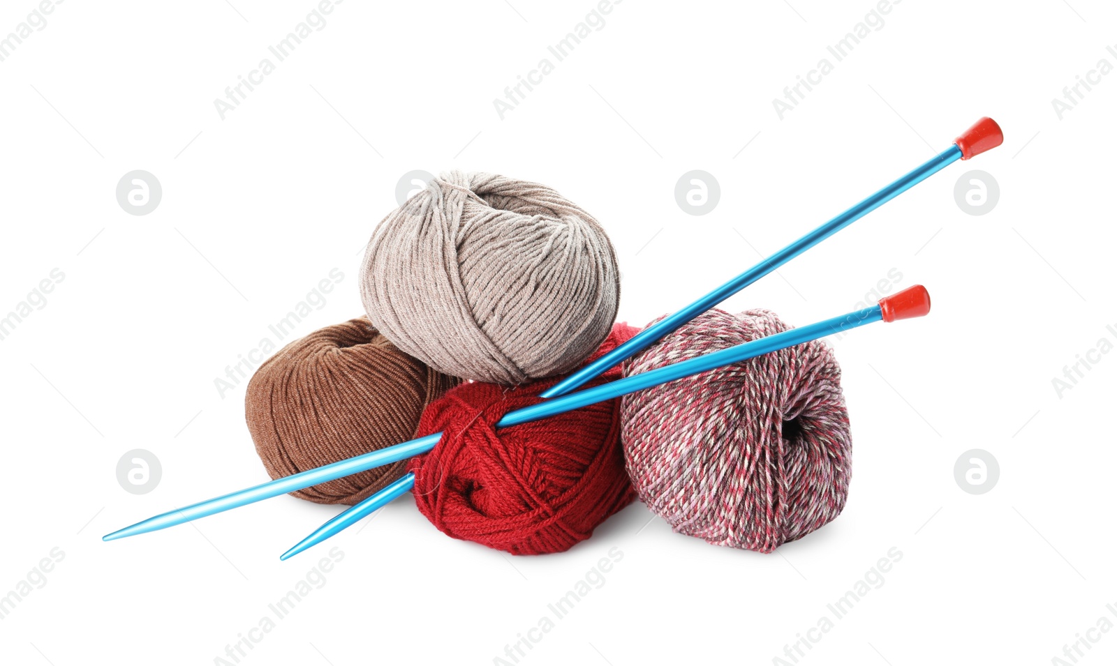 Photo of Different balls of woolen knitting yarns and needles on white background