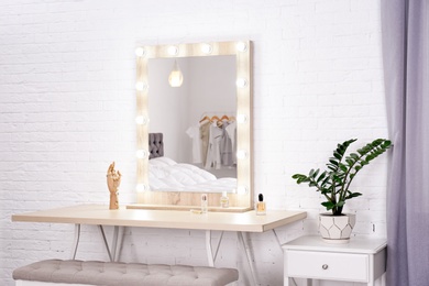 Dressing room interior with makeup mirror and table