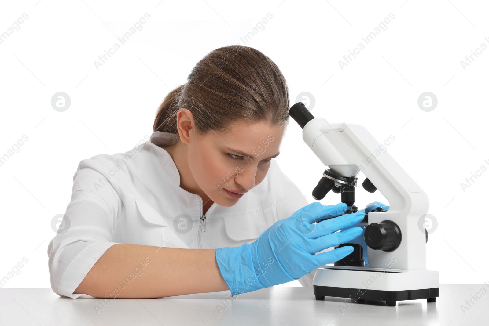 Photo of Scientist using modern microscope at table isolated on white. Medical research