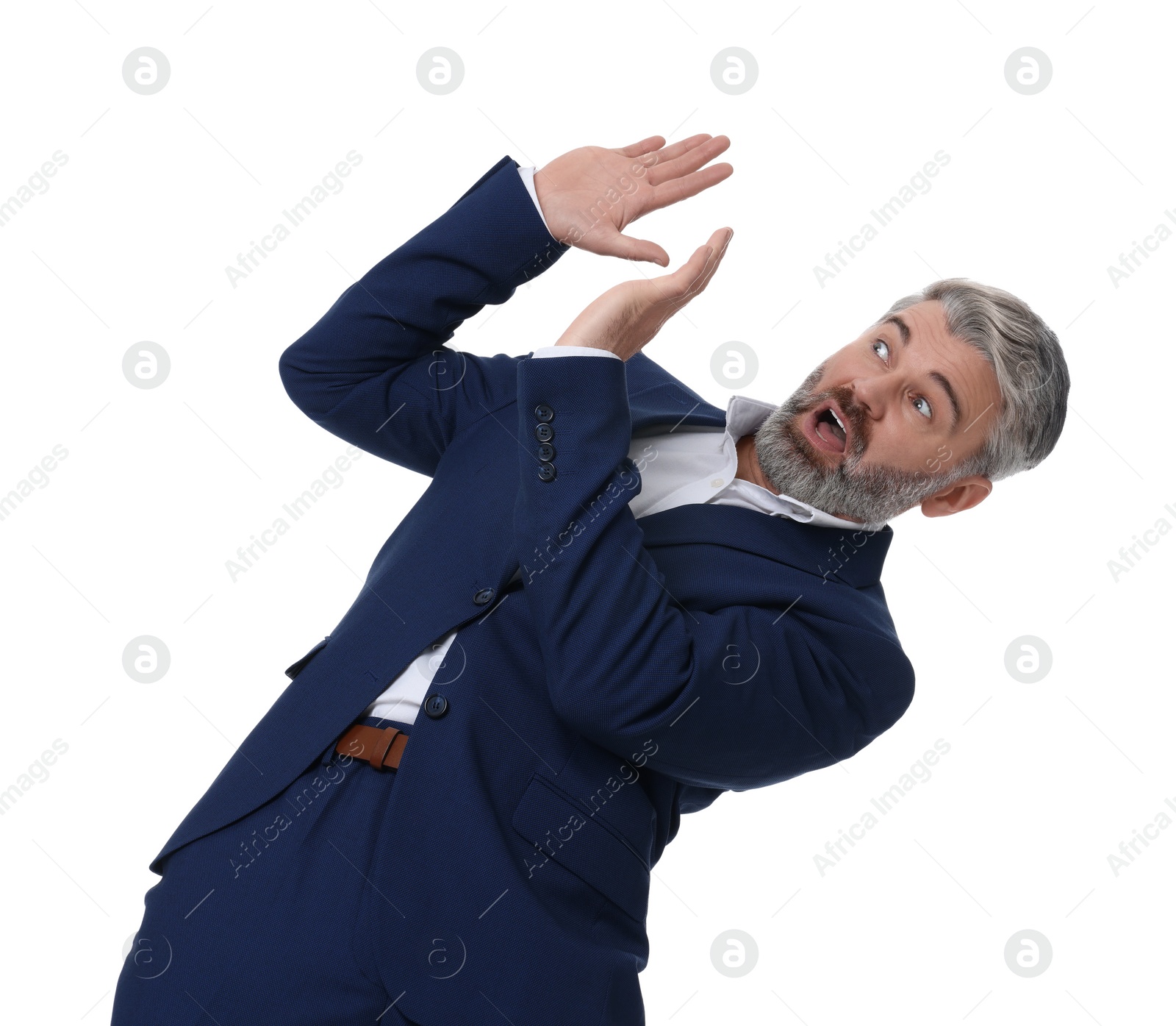 Photo of Mature businessman in stylish clothes avoiding something on white background