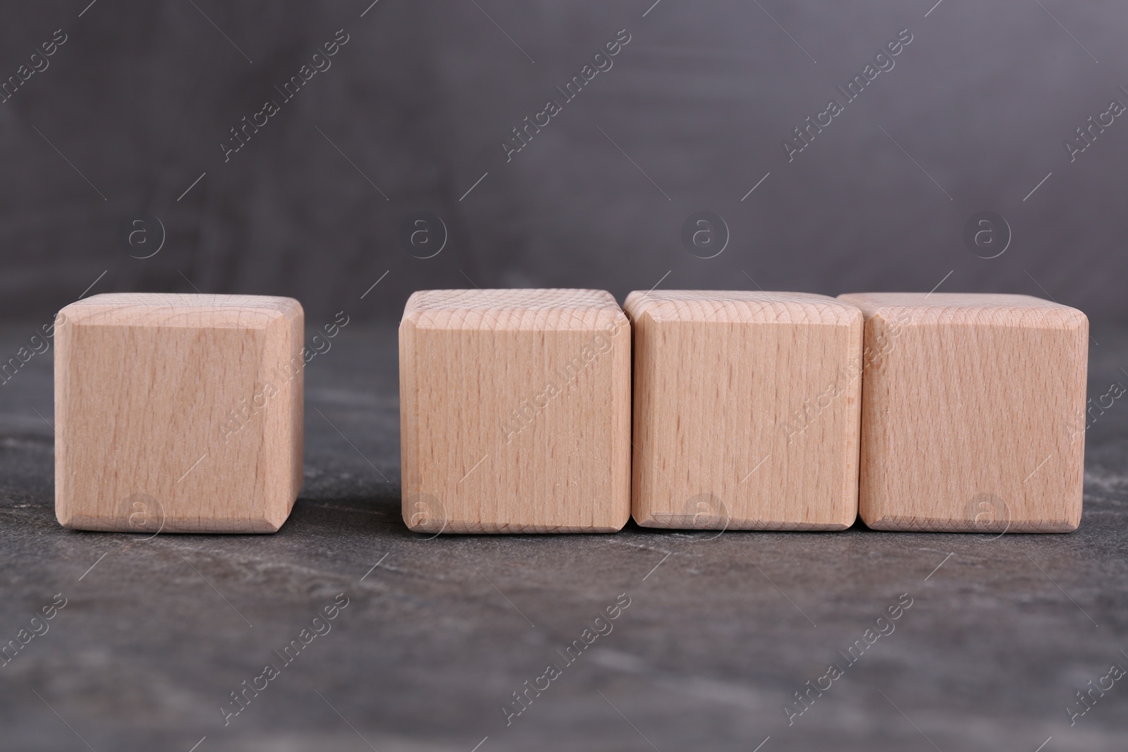 Photo of Cubes with check mark and abbreviation ISO on gray textured table
