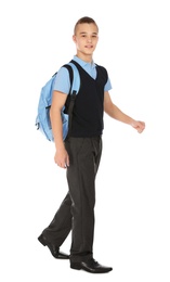 Photo of Full length portrait of teenage boy in school uniform with backpack on white background