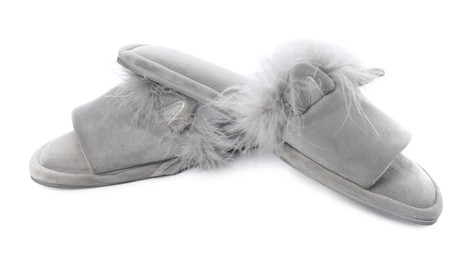 Photo of Pair of soft slippers with fur isolated on white