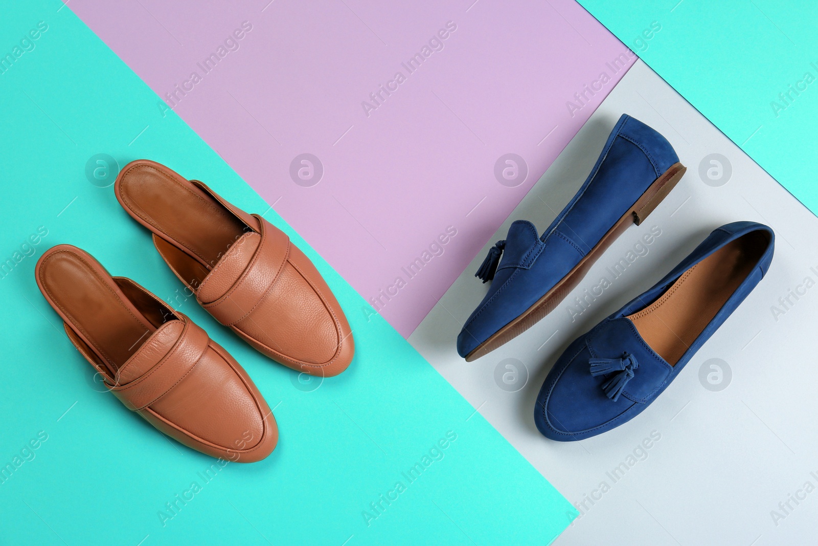 Photo of Different female shoes on color background, top view