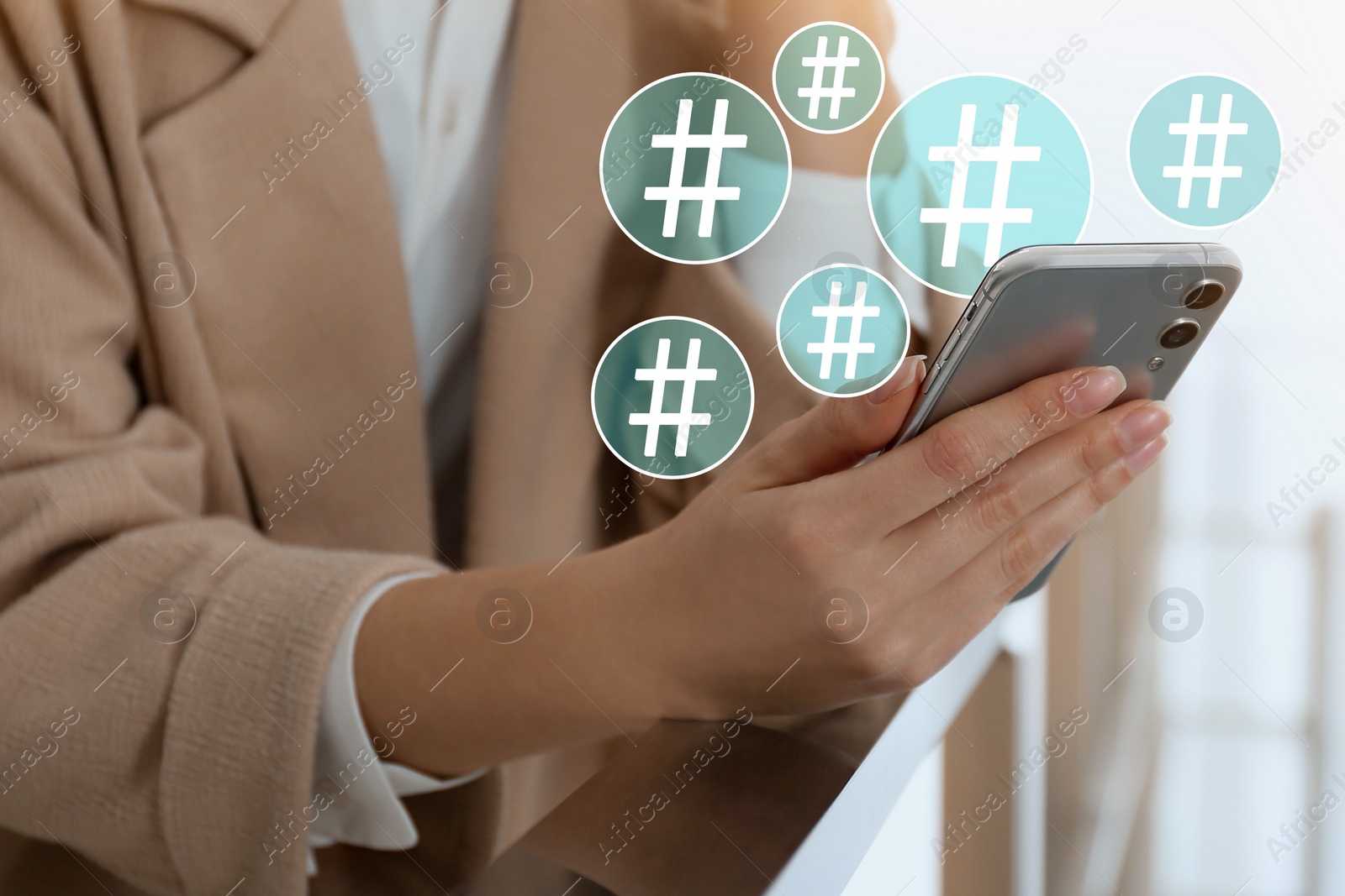 Image of Woman using modern smartphone, closeup. Hashtag symbols over device