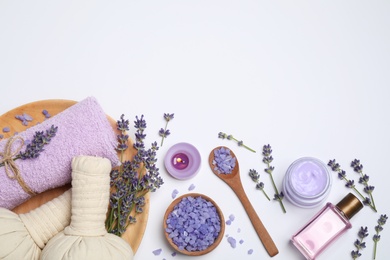 Composition with lavender flowers and natural cosmetic products on white background, top view