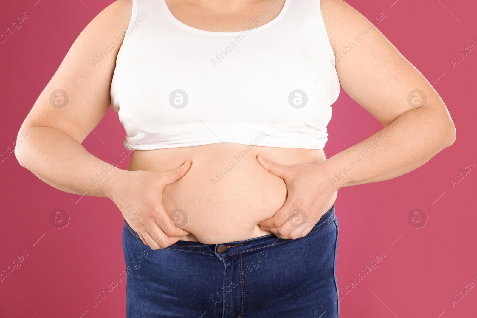 Photo of Overweight woman on color background, closeup. Obesity and weight loss