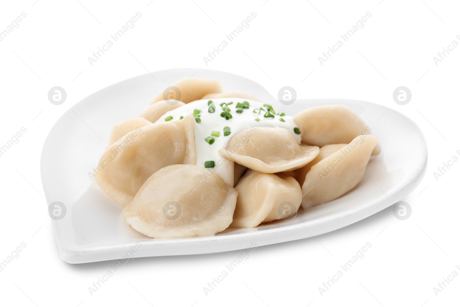 Photo of Delicious cooked dumplings with sour cream on white background